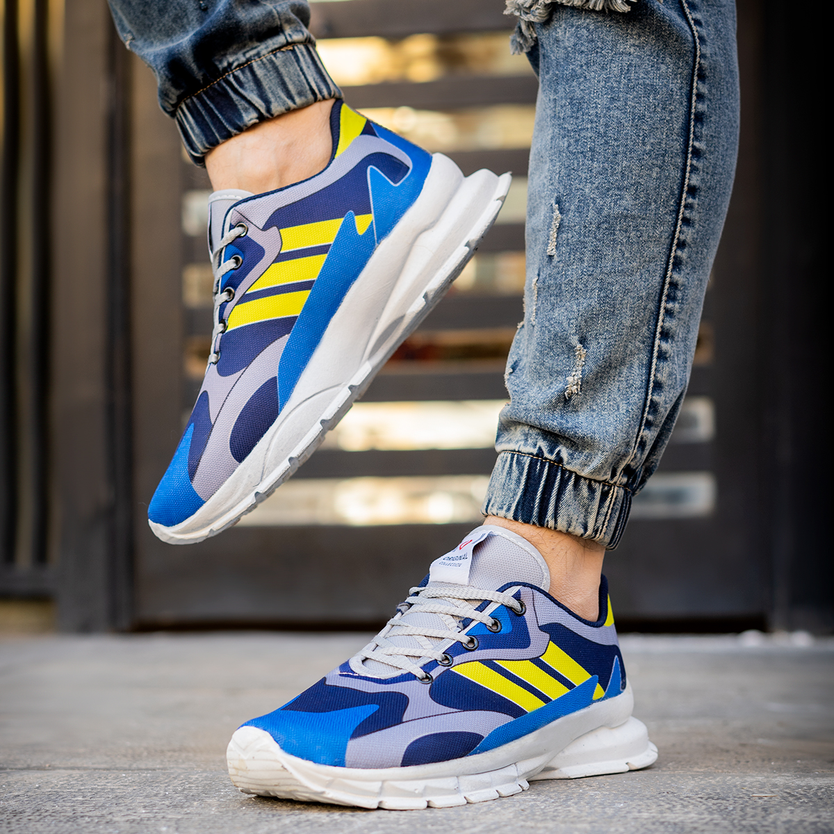 کفش ورزشی Adidas مردانه زرد آبی مدل Tacha